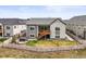 Rear exterior view of the home with a patio, stairs, fenced yard, and a hot tub at 8985 Chalk Creek Pl, Littleton, CO 80125