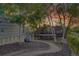 Serene backyard with lush greenery, mature trees, and a trampoline at 5457 S Valdai St, Aurora, CO 80015