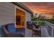 Relax on this cozy balcony with wicker furniture and enjoy the colorful sunset views at 5457 S Valdai St, Aurora, CO 80015