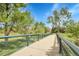 Scenic park bridge with lush greenery, providing access to walking trails and recreational areas at 5457 S Valdai St, Aurora, CO 80015