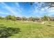 Community park featuring a playground, grassy field, and walking paths at 5457 S Valdai St, Aurora, CO 80015