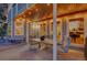 Charming covered deck with outdoor dining area and scenic neighborhood views at 5457 S Valdai St, Aurora, CO 80015