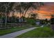 View of a home with a manicured lawn and winding sidewalk at 5457 S Valdai St, Aurora, CO 80015
