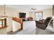 Second-floor living room featuring cozy furnishings, neutral carpet, and a ceiling fan at 5457 S Valdai St, Aurora, CO 80015
