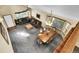 Open-concept living area includes a dining space and multiple windows for plenty of natural light at 5457 S Valdai St, Aurora, CO 80015