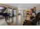 Expansive open living space flowing into the kitchen and dining area, featuring hardwood floors at 5457 S Valdai St, Aurora, CO 80015