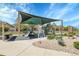 Neighborhood playground featuring modern play structures with shade canopies, surrounded by a pathway and landscaping at 5457 S Valdai St, Aurora, CO 80015