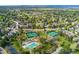 Aerial view of community amenities, including tennis courts, playground, pool and clubhouse at 7770 S Ivy Way, Centennial, CO 80112
