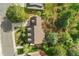Aerial view of a well-maintained home showcasing a brown roof, manicured lawn and mature trees at 7770 S Ivy Way, Centennial, CO 80112