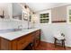 Bathroom with wood floors, double sinks and marble countertop at 7770 S Ivy Way, Centennial, CO 80112