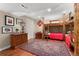 Cozy bedroom with wood floors, bunk beds, and warm decor at 7770 S Ivy Way, Centennial, CO 80112