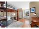 Comfortable bedroom with a cozy lofted bed, natural light and rustic charm at 7770 S Ivy Way, Centennial, CO 80112
