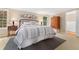 Comfortable bedroom featuring a plush bed, side tables, and serene decor at 7770 S Ivy Way, Centennial, CO 80112