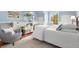 Bright bedroom with beautiful window, chair, and book shelving at 7770 S Ivy Way, Centennial, CO 80112