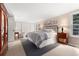 Spacious bedroom featuring a plush bed, side tables, and ample closet space at 7770 S Ivy Way, Centennial, CO 80112