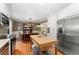 Spacious kitchen with stainless steel appliances, a large island, and ample counter space at 7770 S Ivy Way, Centennial, CO 80112