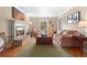 Cozy living room with a fireplace, comfortable seating, and ample natural light at 7770 S Ivy Way, Centennial, CO 80112