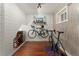Unique workout room featuring bicycle racks, wood paneled walls, and a window at 7770 S Ivy Way, Centennial, CO 80112