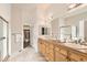 Bathroom featuring double sinks with granite countertops and a separate shower and closet at 10340 Winona Ct, Westminster, CO 80031