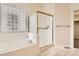 Bright bathroom with a glass block window above a tub and a glass shower at 10340 Winona Ct, Westminster, CO 80031