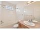 Clean bathroom featuring a bathtub, shower, and a large mirror above the sink at 10340 Winona Ct, Westminster, CO 80031