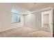 Bright bedroom featuring neutral carpet, white walls, a window, and a closet with doors at 10340 Winona Ct, Westminster, CO 80031