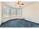 Empty bedroom with a ceiling fan, bright window, and neutral walls at 10340 Winona Ct, Westminster, CO 80031