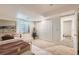 Bright bedroom featuring neutral carpet, white walls, a window, and a closet with doors at 10340 Winona Ct, Westminster, CO 80031