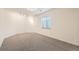 Bright bedroom featuring neutral carpet, white walls, and a window at 10340 Winona Ct, Westminster, CO 80031