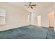 Spacious bedroom with a ceiling fan, bright window, and neutral walls at 10340 Winona Ct, Westminster, CO 80031