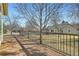 Wide wooden deck with black metal railings overlooking backyard at 10340 Winona Ct, Westminster, CO 80031