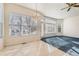 Dining area boasts large windows, a modern light fixture, and seamless flow into other living spaces at 10340 Winona Ct, Westminster, CO 80031