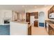 Well-designed kitchen with breakfast bar, granite countertops and wood cabinets connecting to a fireplace in the next room at 10340 Winona Ct, Westminster, CO 80031