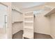 Neat walk-in closet with shelving units and a small window for natural light at 10340 Winona Ct, Westminster, CO 80031