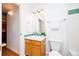 Cozy bathroom featuring a classic vanity with a mirror and overhead lighting at 1747 N Washington St # C303, Denver, CO 80203