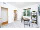 Bright bedroom featuring a modern desk space and access to an ensuite bathroom at 1747 N Washington St # C303, Denver, CO 80203