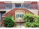 Close-up of a red brick building displaying the address number '1747' at 1747 N Washington St # C303, Denver, CO 80203