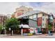 Multistory buildings with a restaurant featuring outdoor seating at the street corner at 1747 N Washington St # C303, Denver, CO 80203