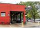 Bright red building featuring Marczyk Fine Foods with large windows and outdoor seating at 1747 N Washington St # C303, Denver, CO 80203