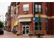 Fluid Coffee Bar exterior with outdoor seating, red brick, and large windows at 1747 N Washington St # C303, Denver, CO 80203