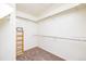 Walk-in closet with built-in shelving and hanging rods, providing ample storage space at 1747 N Washington St # C303, Denver, CO 80203