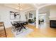 Bright dining room with modern light fixture, contemporary art, and open floor plan at 1747 N Washington St # C303, Denver, CO 80203