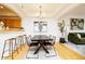 Stylish dining room featuring modern lighting and an open floor plan to the living area at 1747 N Washington St # C303, Denver, CO 80203