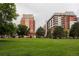 Buildings backing to a grassy park area at 1747 N Washington St # C303, Denver, CO 80203