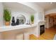 Cozy living area with a fireplace, built-in shelving and an arched doorway at 1747 N Washington St # C303, Denver, CO 80203