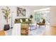 Bright living space with a sofa, chairs, and sliding glass door to a balcony at 1747 N Washington St # C303, Denver, CO 80203