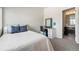 Bedroom with a twin bed, makeup vanity with lights, chair, and an ensuite bathroom at 15550 W 64Th Pl # D, Arvada, CO 80007