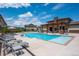 Inviting community pool with lounge chairs and covered seating offering residents a relaxing outdoor space at 15550 W 64Th Pl # D, Arvada, CO 80007