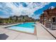 Sparkling community pool with nearby seating offering residents a refreshing and social outdoor space at 15550 W 64Th Pl # D, Arvada, CO 80007