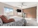 Spacious main bedroom featuring neutral walls, mounted TV, and ample natural light at 15550 W 64Th Pl # D, Arvada, CO 80007